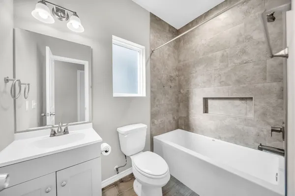 a bathroom with a sink a toilet and a bathtub