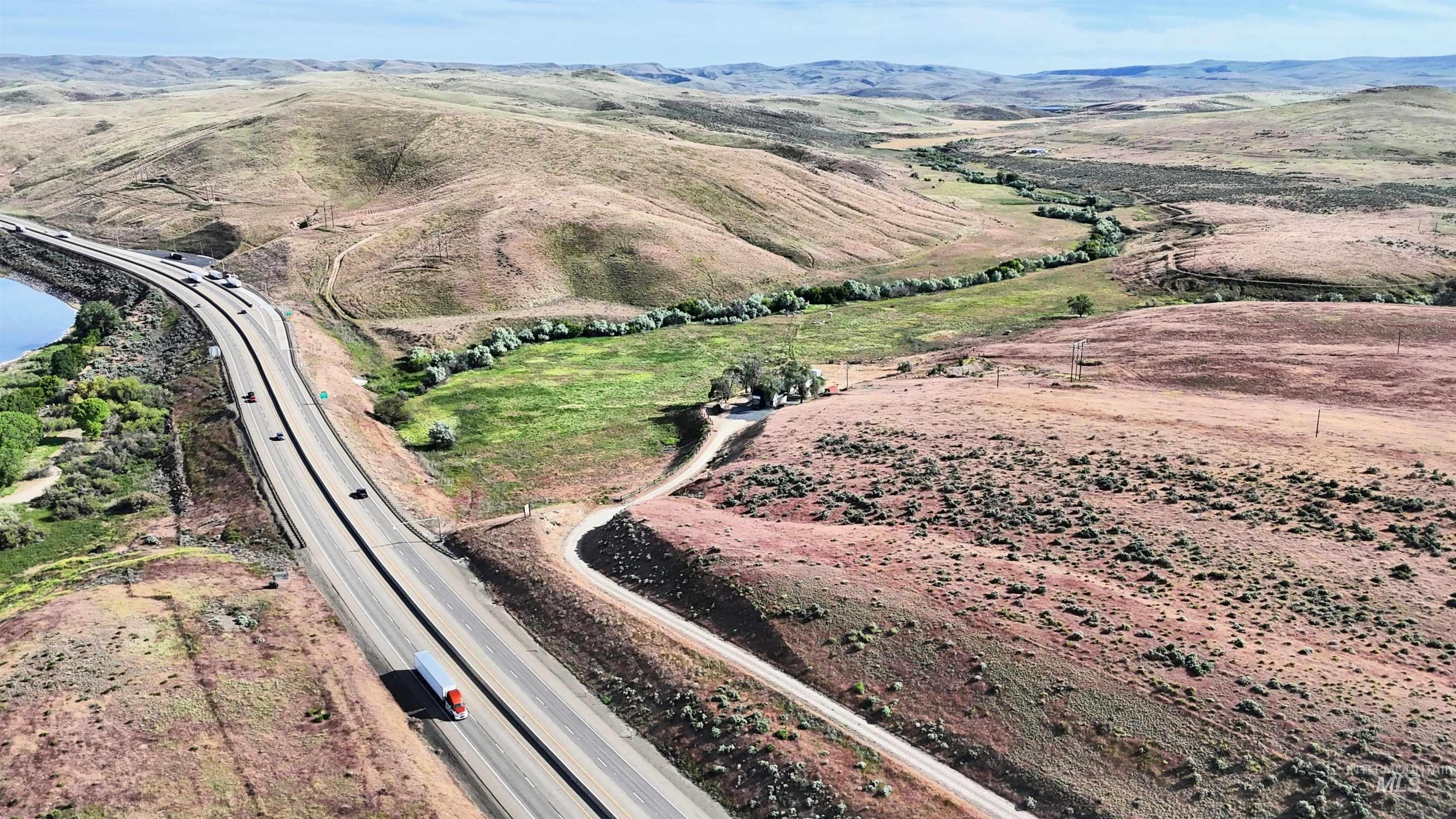 5850 Lockett Road Huntington, OR 97907 - Photo 16 of 49 Aerial view of property and surrounding area featuring a mountainous background