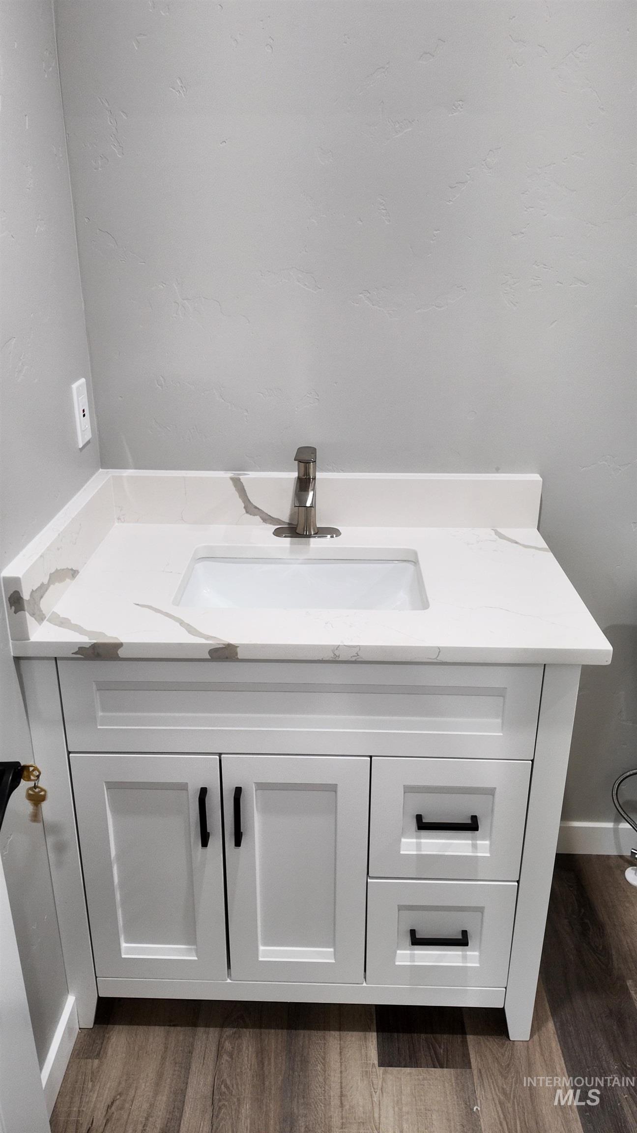 5850 Lockett Road Huntington, OR 97907 - Photo 26 of 49 Bathroom featuring vanity and wood finished floors