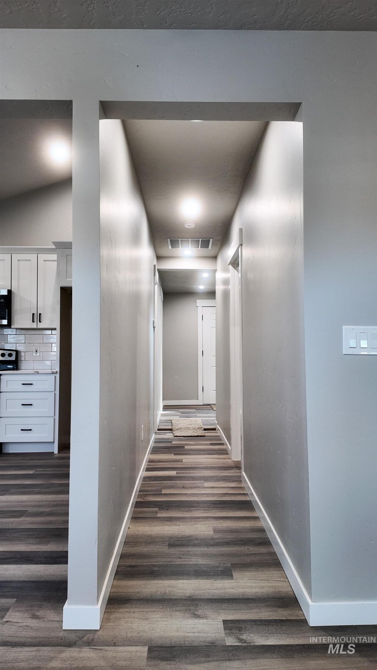 5850 Lockett Road Huntington, OR 97907 - Photo 28 of 49 Corridor featuring dark wood-style floors