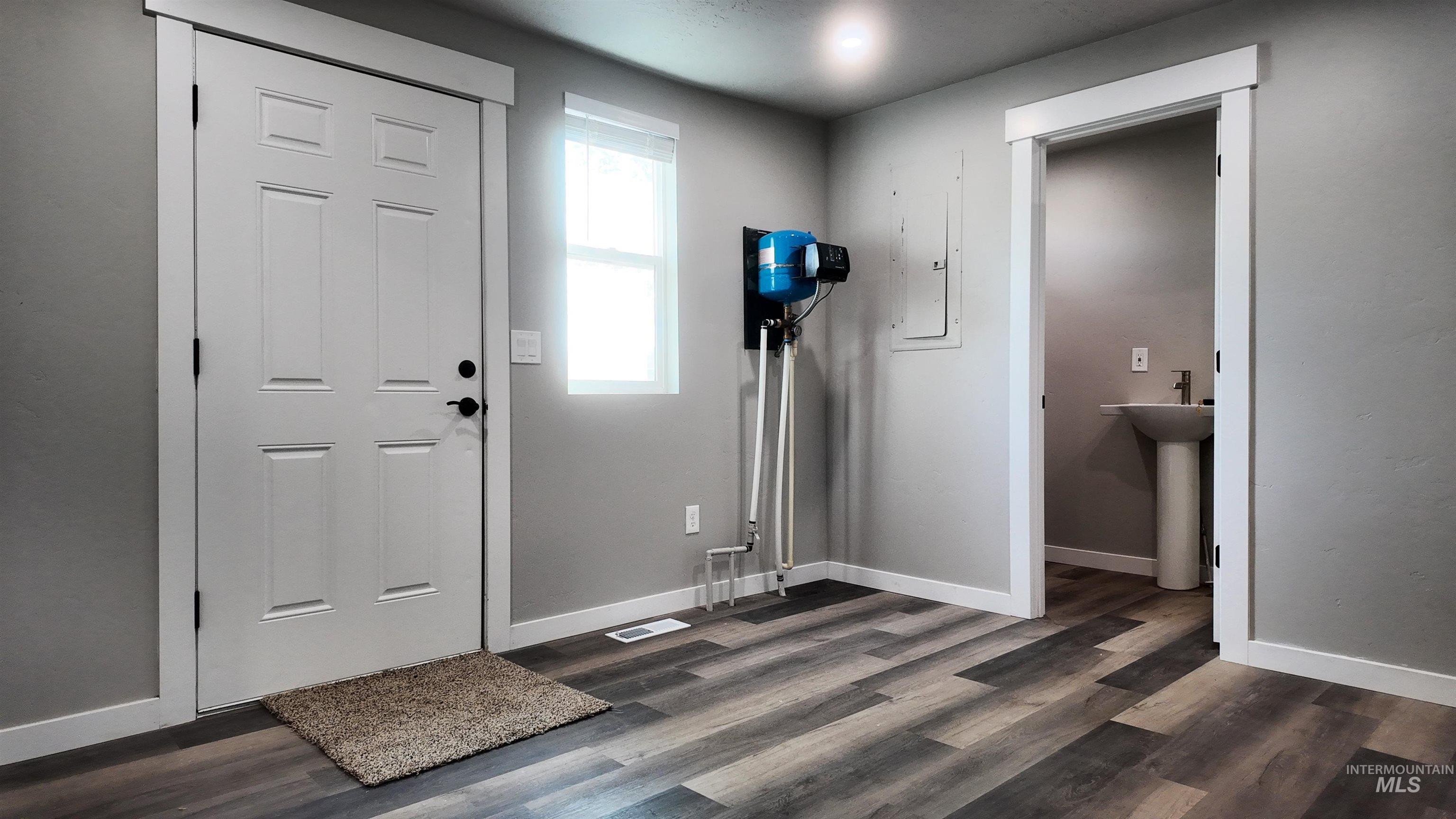 5850 Lockett Road Huntington, OR 97907 - Photo 29 of 49 Foyer with electric panel and dark wood-style flooring