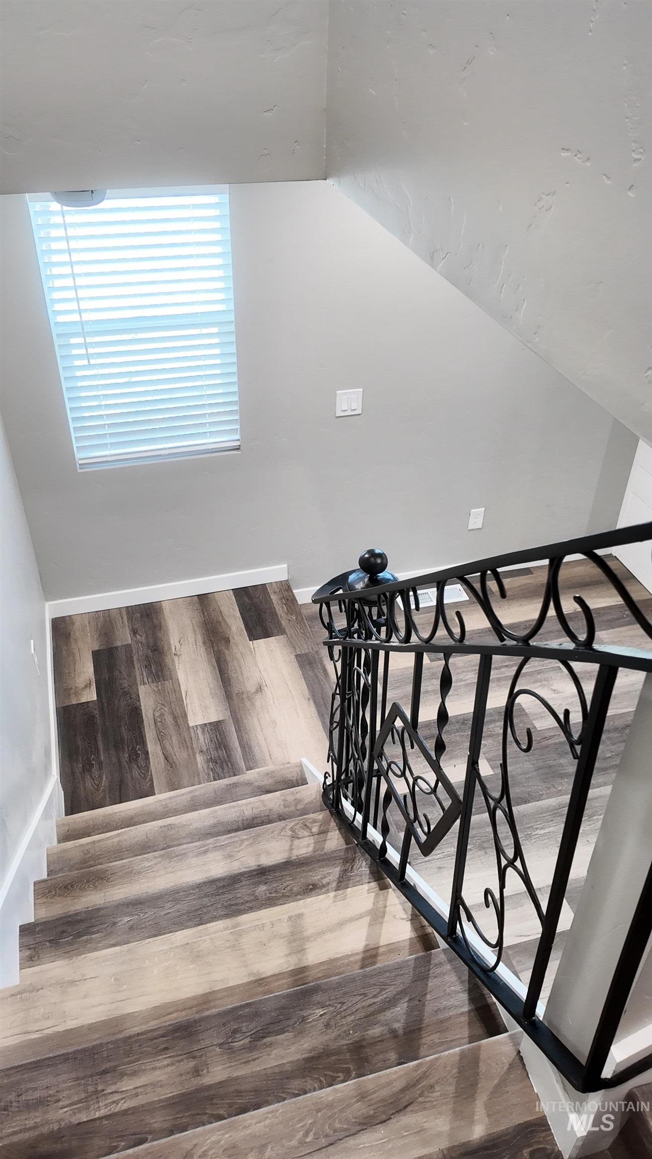 5850 Lockett Road Huntington, OR 97907 - Photo 37 of 49 Stairway featuring wood finished floors and vaulted ceiling
