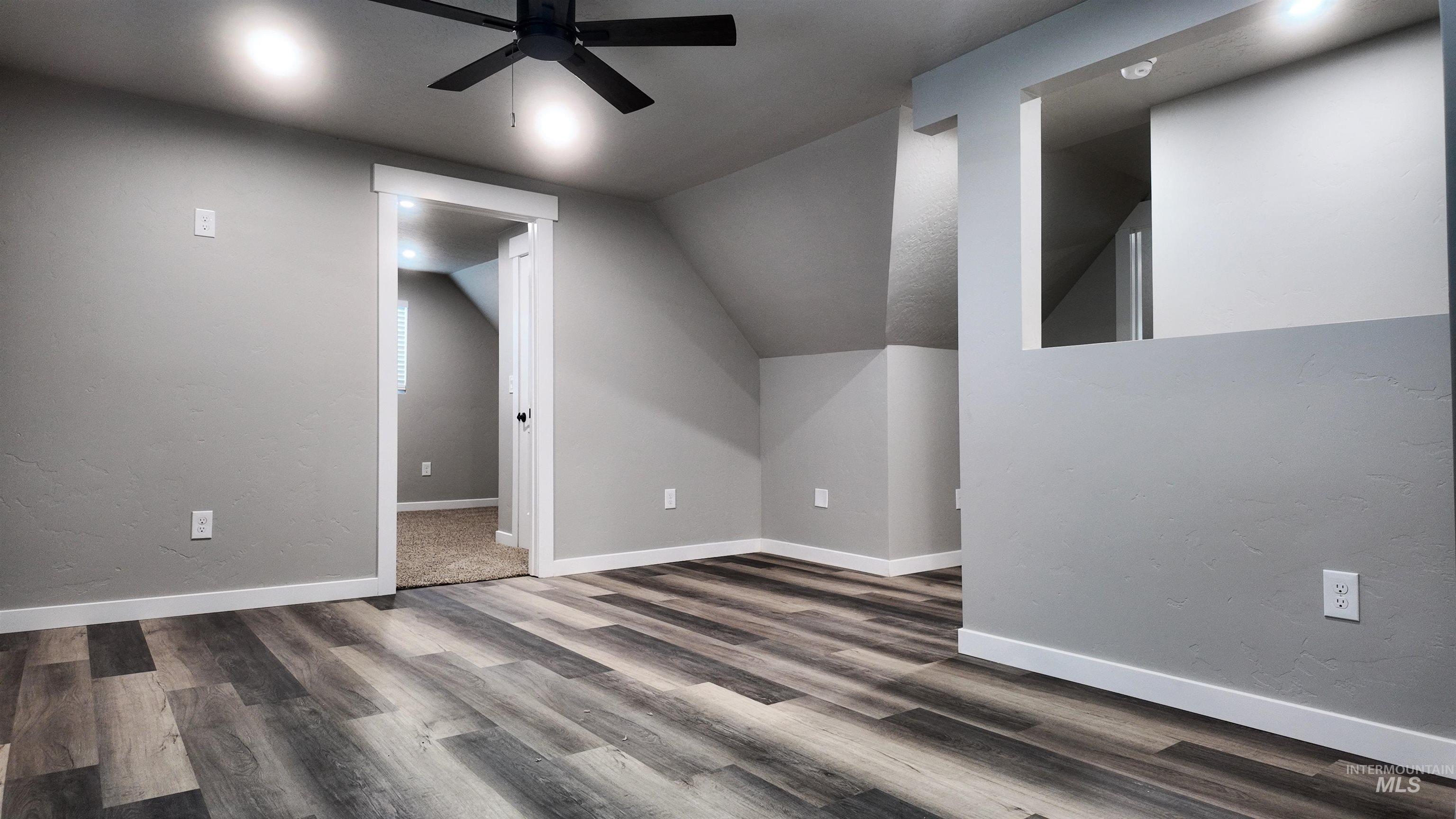 5850 Lockett Road Huntington, OR 97907 - Photo 42 of 49 Additional living space featuring a ceiling fan, lofted ceiling, wood finished floors, and a textured wall