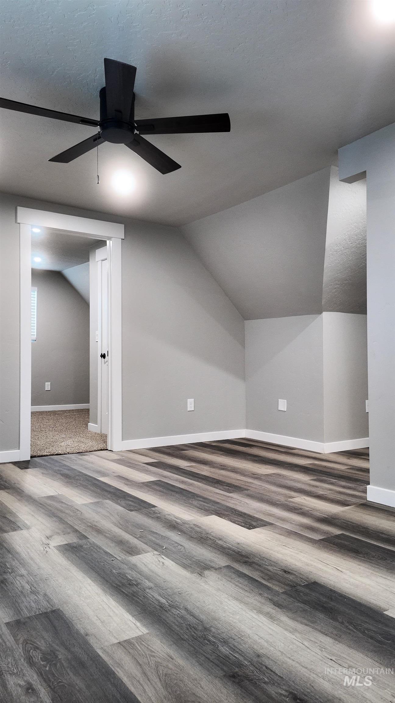5850 Lockett Road Huntington, OR 97907 - Photo 43 of 49 Additional living space featuring wood finished floors, a textured ceiling, vaulted ceiling, and ceiling fan
