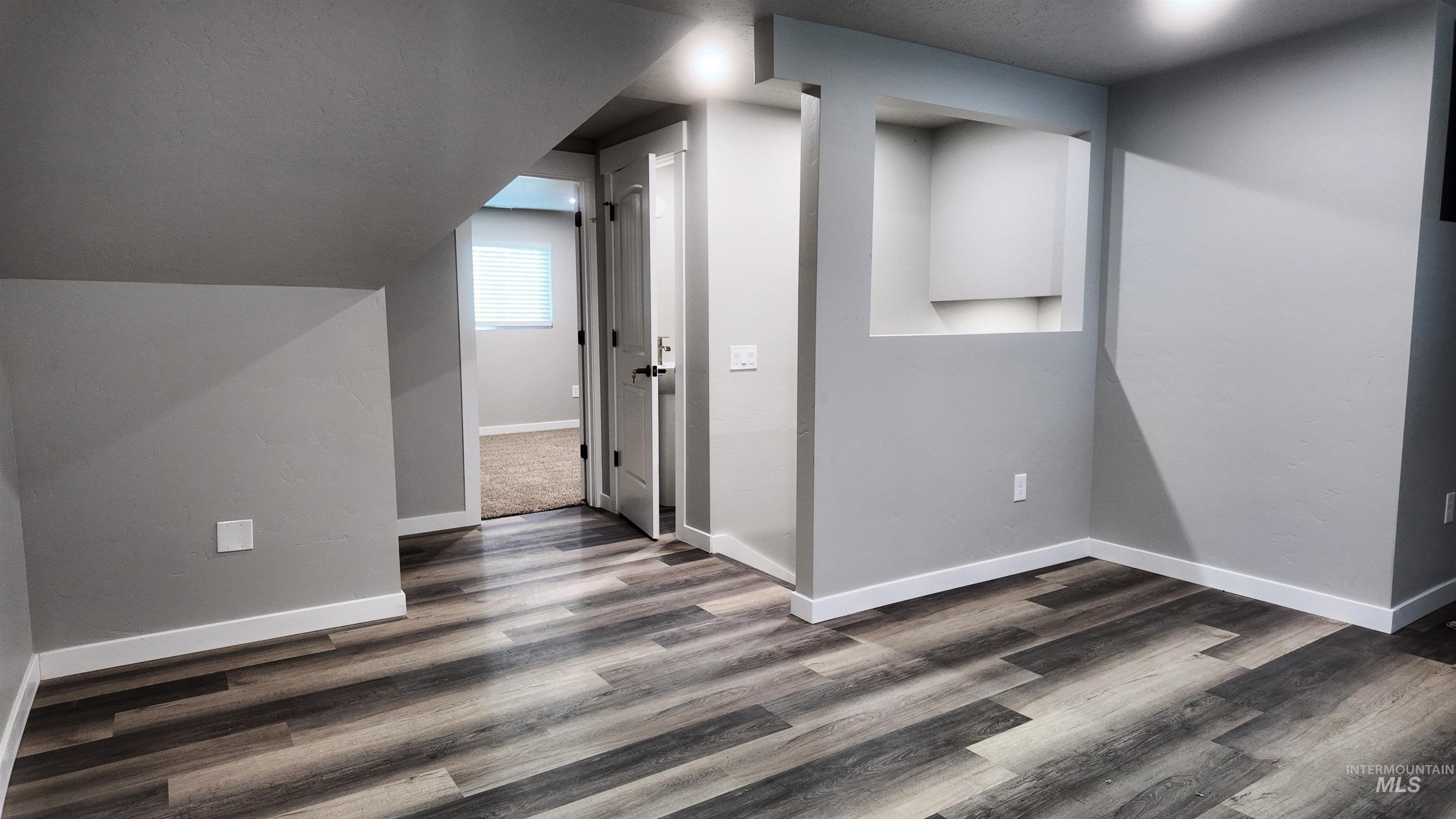 5850 Lockett Road Huntington, OR 97907 - Photo 44 of 49 Additional living space featuring baseboards and dark wood-type flooring