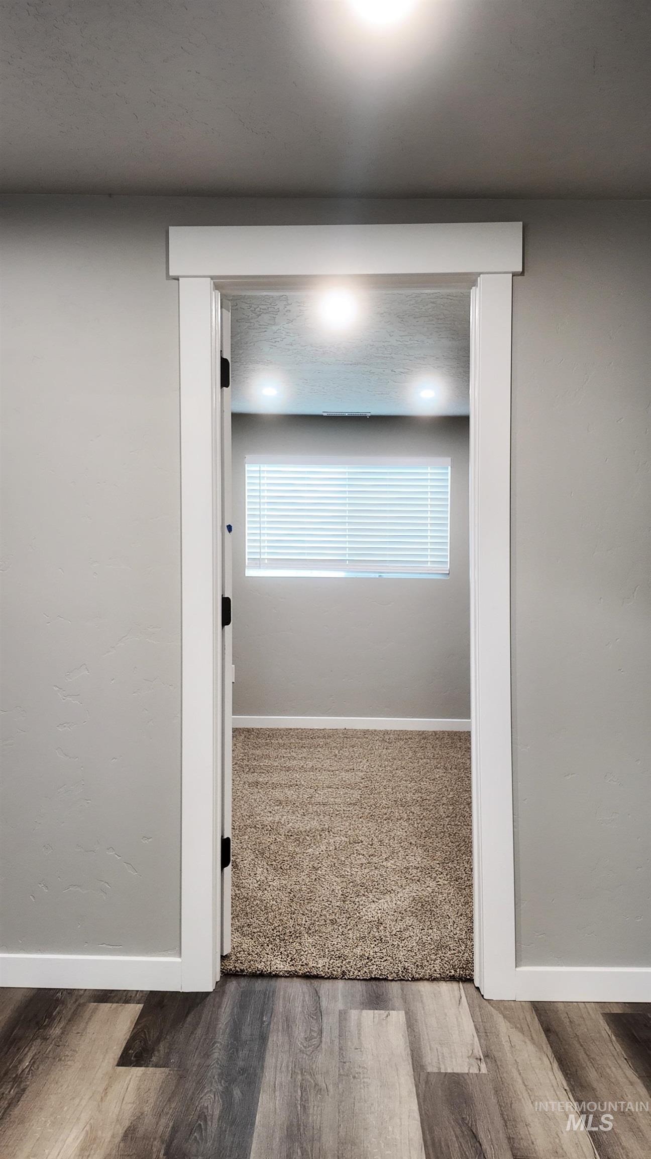 5850 Lockett Road Huntington, OR 97907 - Photo 47 of 49 Hallway with baseboards and wood finished floors