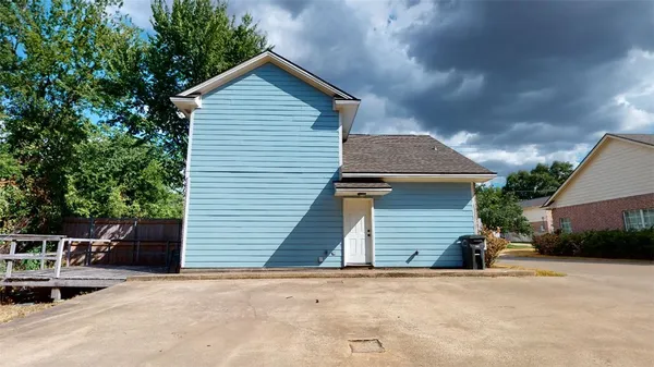 a front view of a house with garage