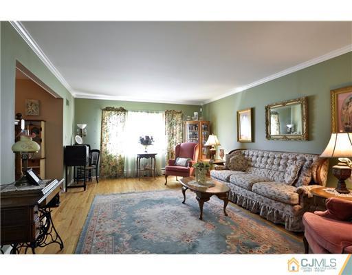 14 Warwick Road Edison, NJ 08820 - Photo 2 of 18 a living room with furniture and a wooden floor