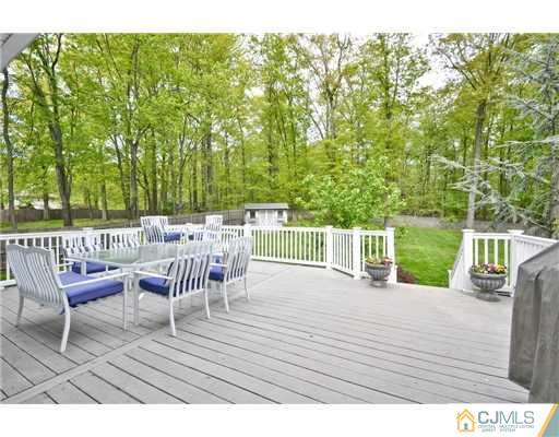 14 Warwick Road Edison, NJ 08820 - Photo 14 of 18 a view of a chairs and table on the wooden floor