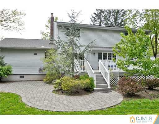 14 Warwick Road Edison, NJ 08820 - Photo 15 of 18 a front view of a house with a yard