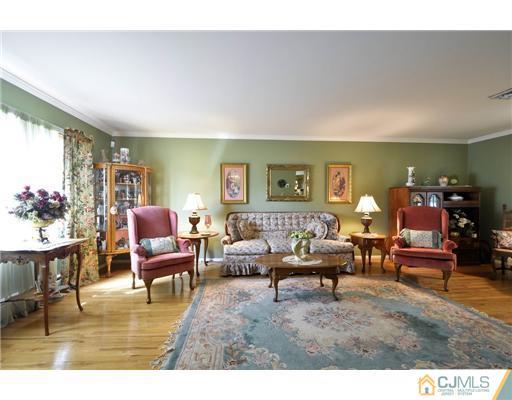 14 Warwick Road Edison, NJ 08820 - Photo 3 of 18 a living room with furniture and wooden floor