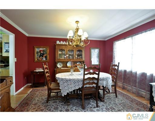 14 Warwick Road Edison, NJ 08820 - Photo 5 of 18 a dining room with furniture a chandelier and window