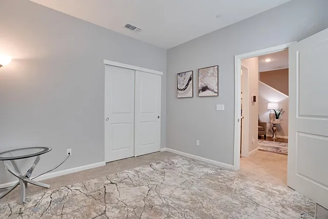 a view of a room with window and wooden floor