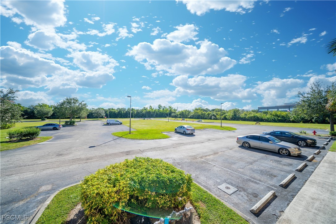 4160 Castilla Circle, Unit 202 Fort Myers, FL 33916 - Photo 25 of 37 a view of a swimming pool and lake view