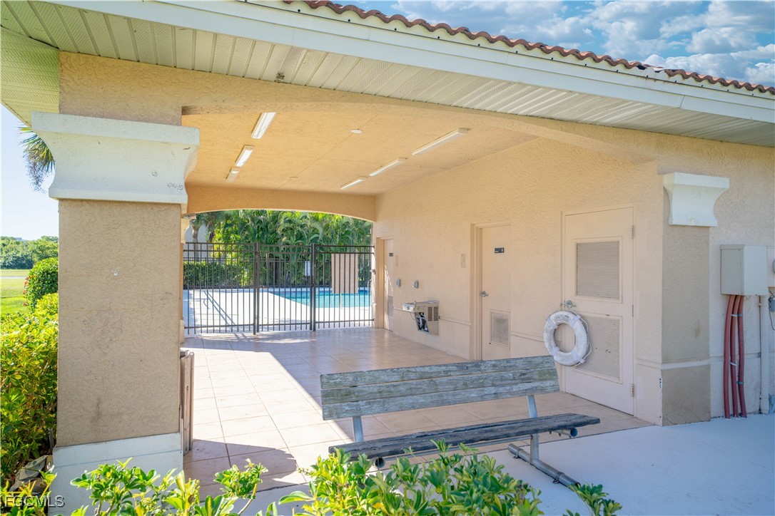 4160 Castilla Circle, Unit 202 Fort Myers, FL 33916 - Photo 30 of 37 a front view of a house with a garden