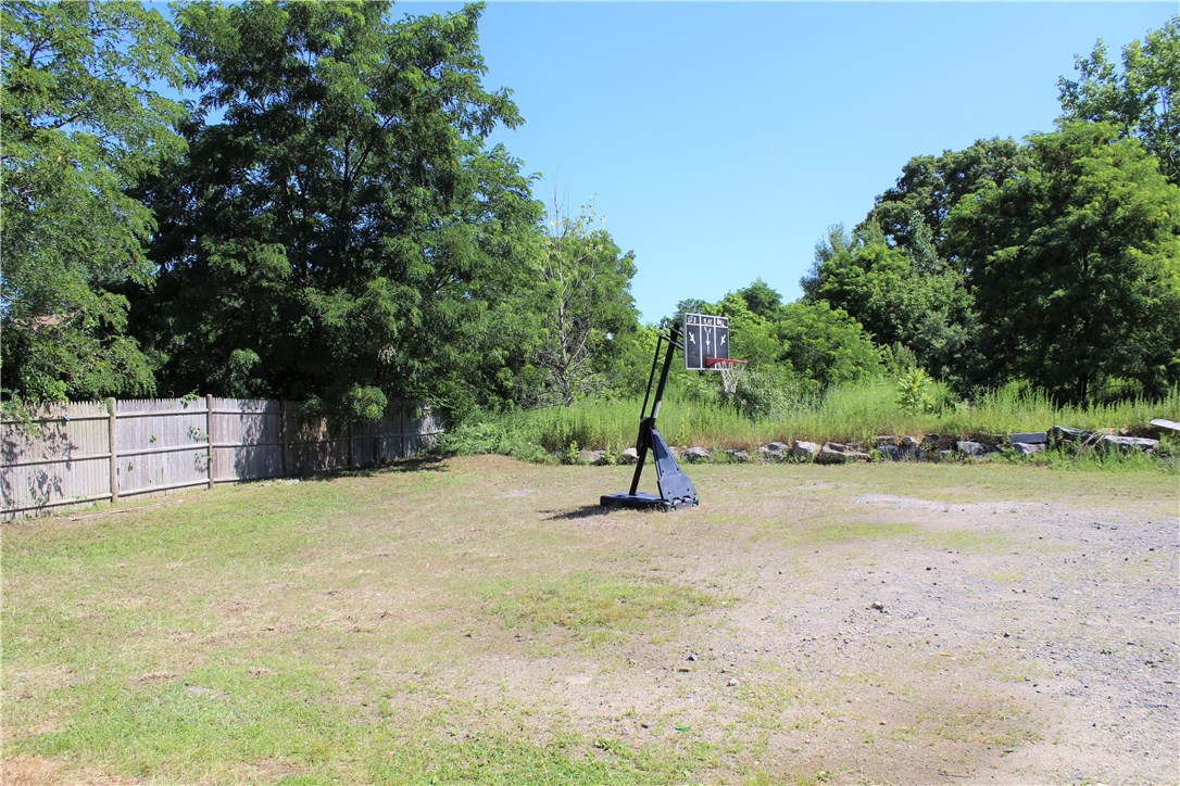 268 Asylum Street Woonsocket, RI 02895 - Photo 21 of 21 Large backyard! Think of how many different things you can do back here.... garden, flowers, basketball court (sorry, this basketball hoop not included), pool, deck, etc.!