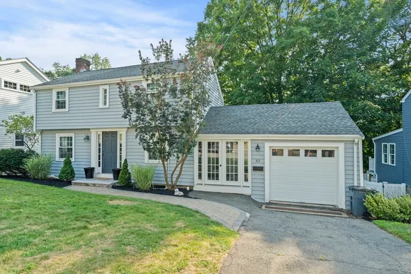 front view of a house with a yard