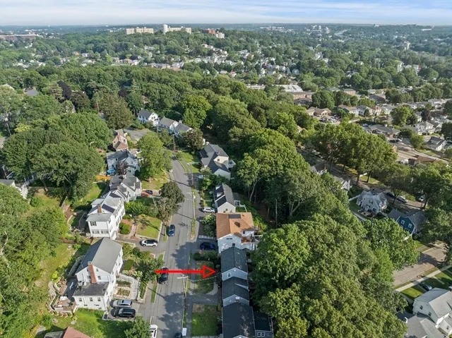 a view of a back yard from a balcony