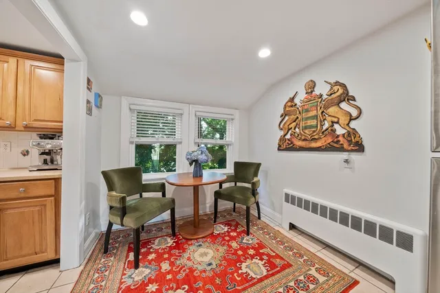 a kitchen with stainless steel appliances a stove refrigerator and microwave