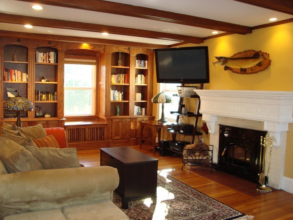 2 Chesterlee Lane Swampscott, MA 01907 - Photo 11 of 29 a living room with fireplace furniture and a flat screen tv