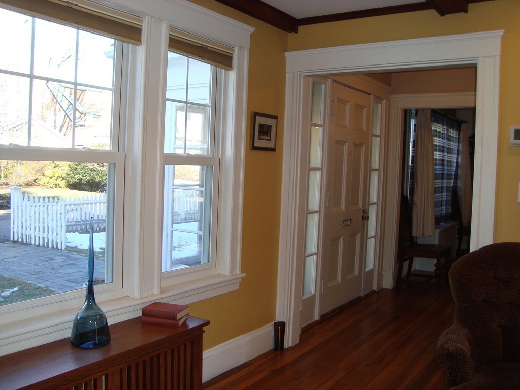 2 Chesterlee Lane Swampscott, MA 01907 - Photo 12 of 29 a view of a livingroom with wooden floor and windows