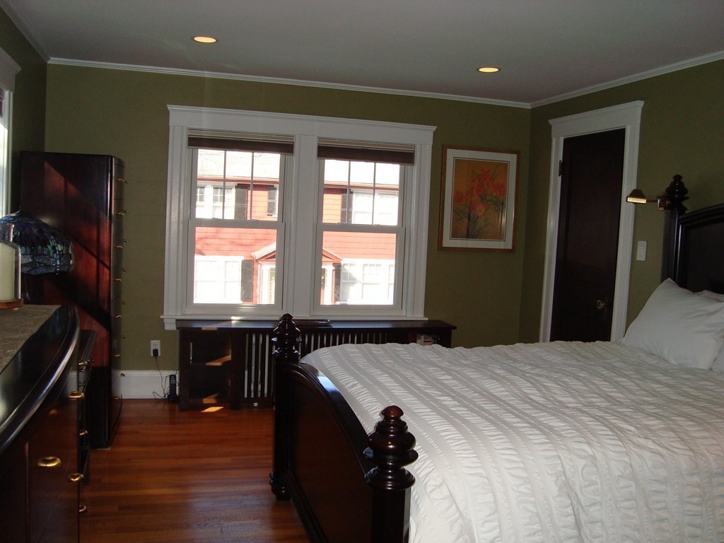 2 Chesterlee Lane Swampscott, MA 01907 - Photo 16 of 29 a bedroom with a bed and a table in it