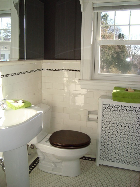 2 Chesterlee Lane Swampscott, MA 01907 - Photo 22 of 29 a bathroom with a toilet a sink and a window