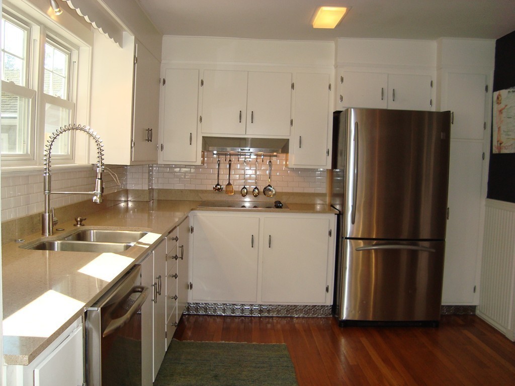 2 Chesterlee Lane Swampscott, MA 01907 - Photo 4 of 29 a kitchen with a refrigerator sink and cabinets