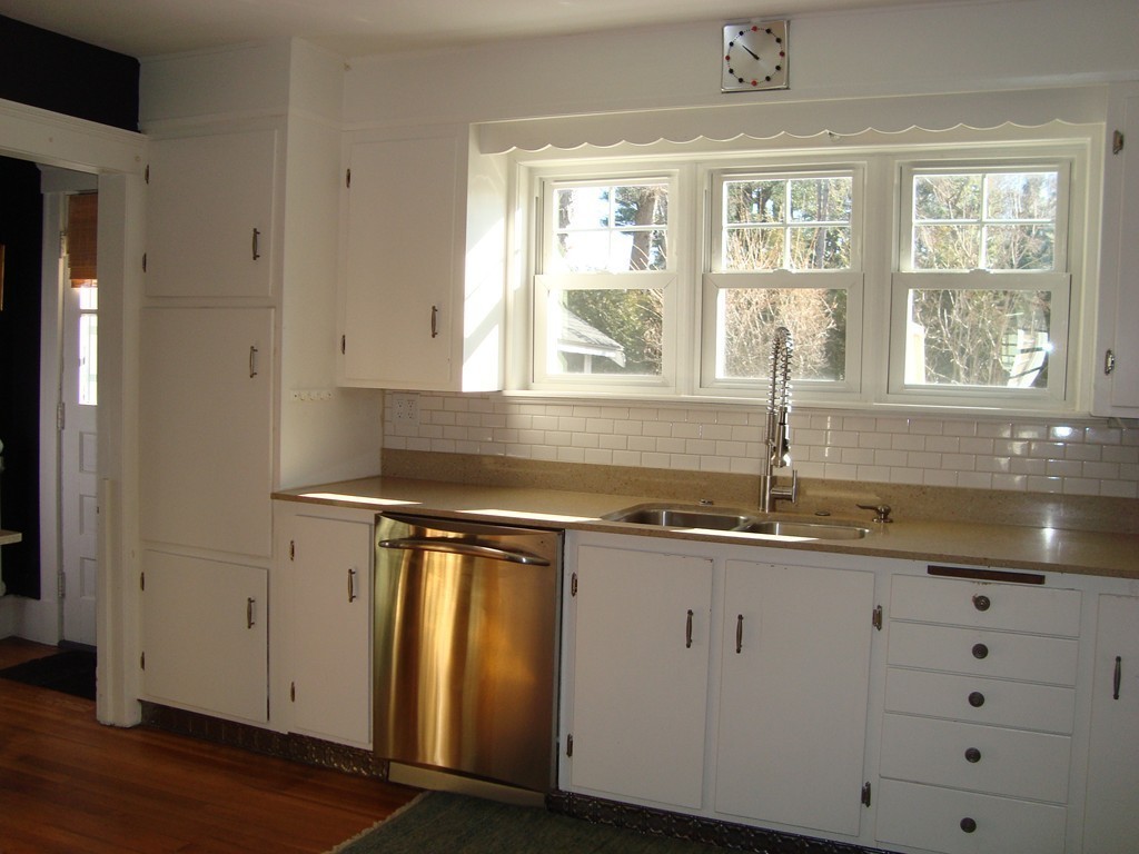 2 Chesterlee Lane Swampscott, MA 01907 - Photo 5 of 29 a kitchen with granite countertop a sink and a window