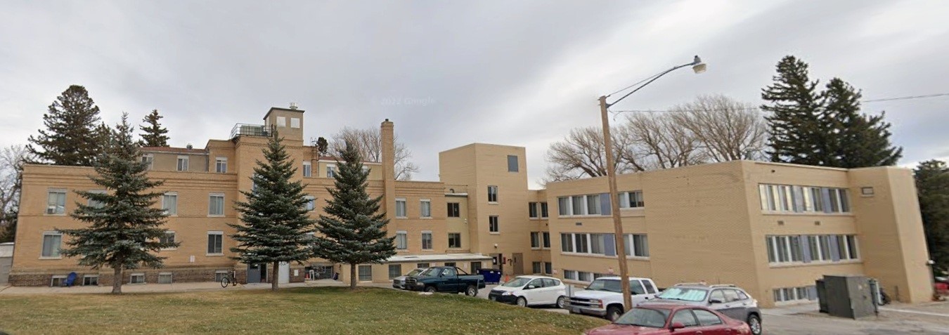 548 15th Street Rawlins, WY 82301 - Photo 4 of 7 a city street lined with buildings and trees