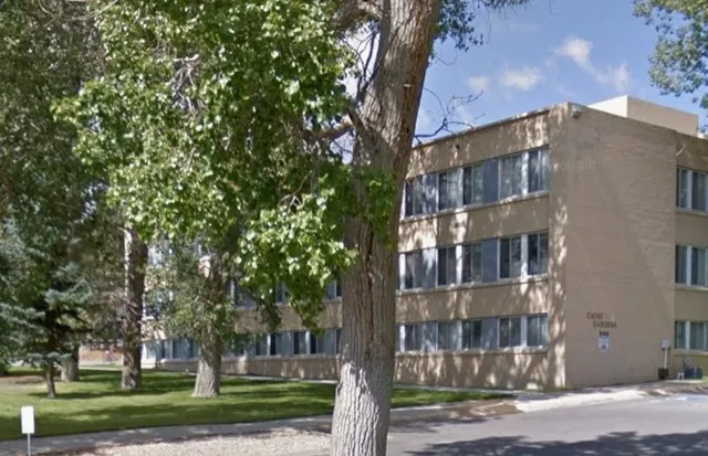 a view of a building with a yard