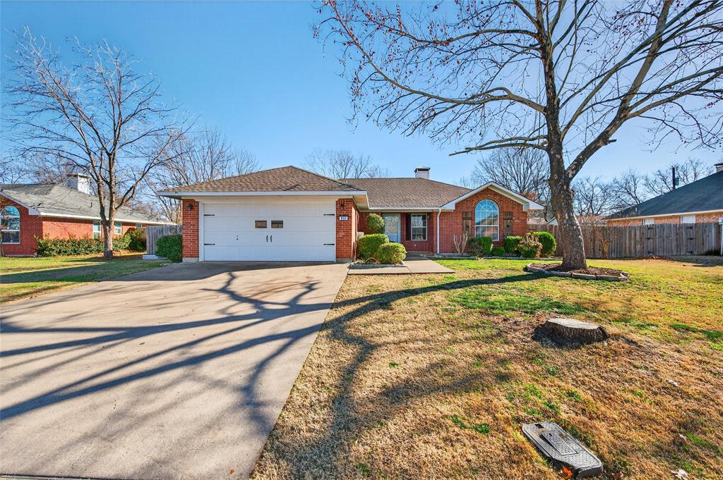 905 Calder Street Howe, TX 75459 - Photo 2 of 35 a front view of a house with a yard