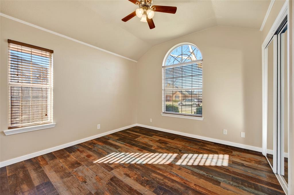 905 Calder Street Howe, TX 75459 - Photo 27 of 35 a view of an empty room with wooden floor and a window