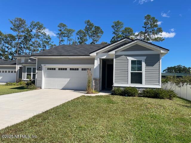 1852 Cogdill Trace Middleburg, FL 32068 - Photo 1 of 25 a front view of a house with a yard and garage