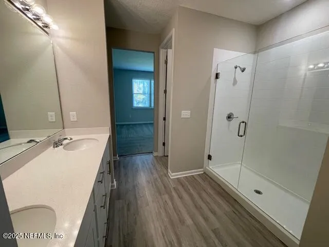 a bathroom with a sink and shower