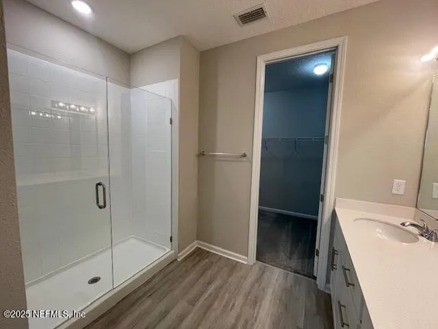 a bathroom with a sink and a shower