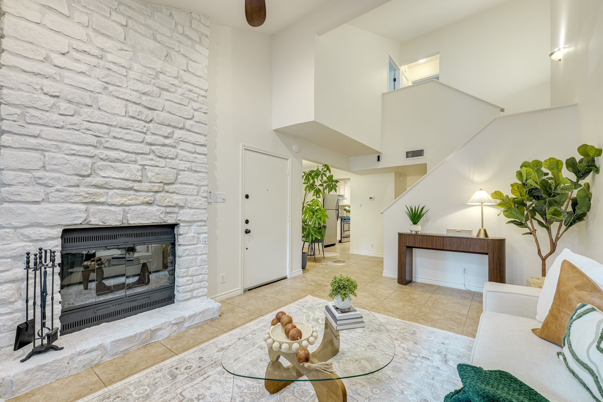 2500 Enfield Road, Unit 9 Austin, TX 78703 - Photo 6 of 26 Stone-clad fireplace with a hearth and glass doors