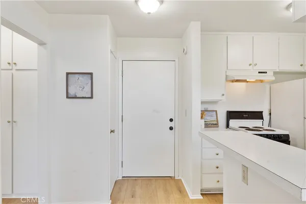 a view of cabinets with wooden floor