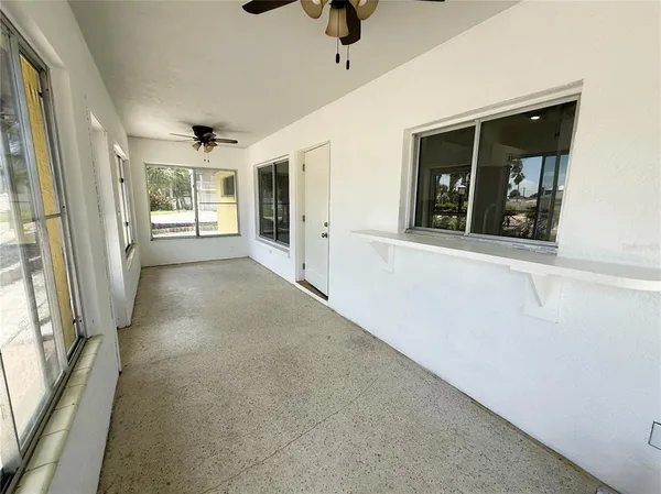 a view of a hallway with windows
