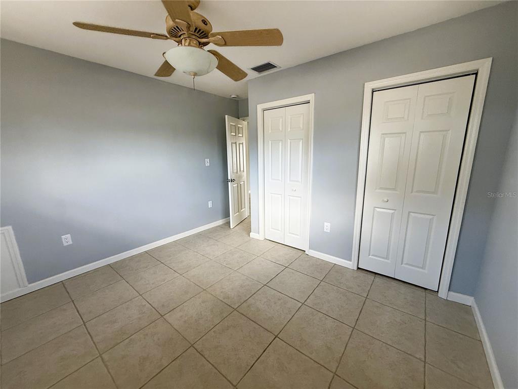 500 140th Avenue East Madeira Beach, FL 33708 - Photo 17 of 30 an empty room with fan and entrance