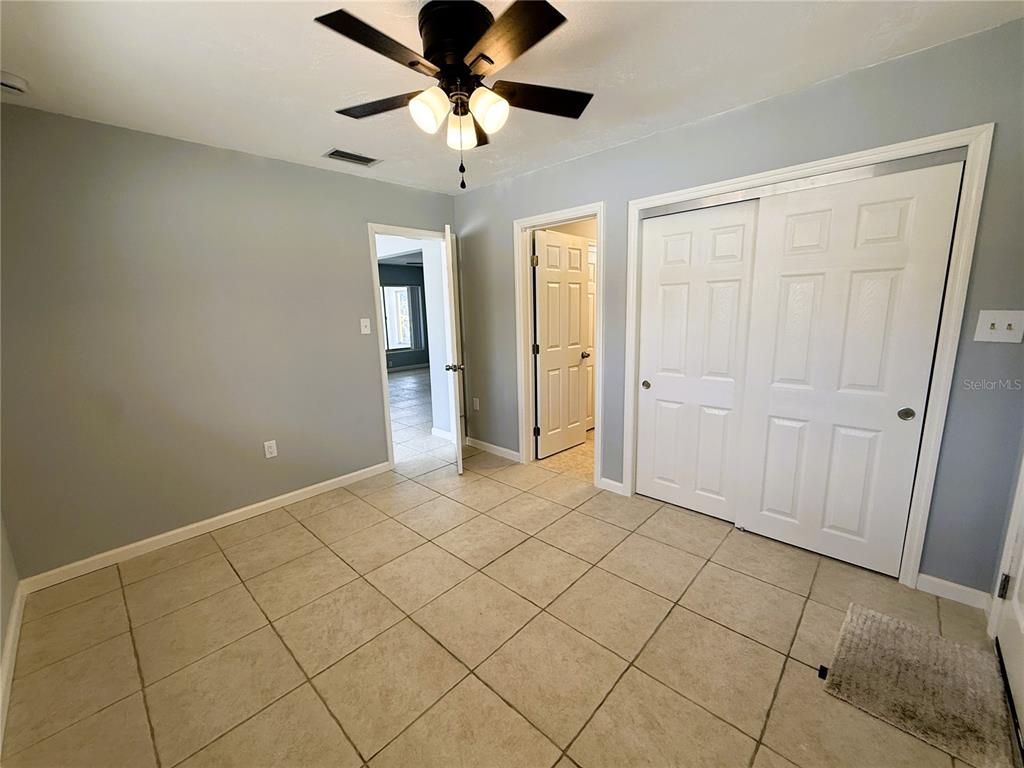 500 140th Avenue East Madeira Beach, FL 33708 - Photo 18 of 30 a view of an empty room and chandelier fan