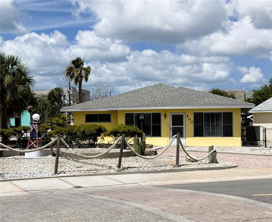 500 140th Avenue East Madeira Beach, FL 33708 - Photo 20 of 30 a front view of a house with a view of a house