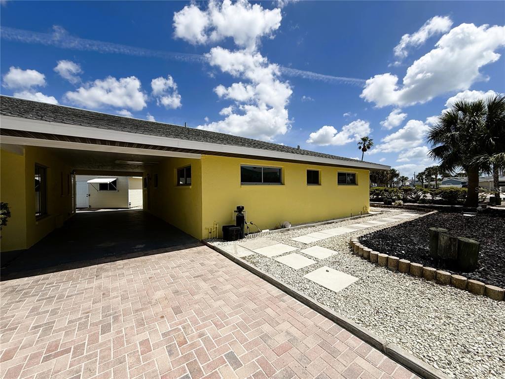 500 140th Avenue East Madeira Beach, FL 33708 - Photo 23 of 30 a front view of a house with a yard