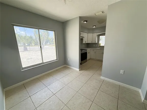 a view of a kitchen with a sink and a window
