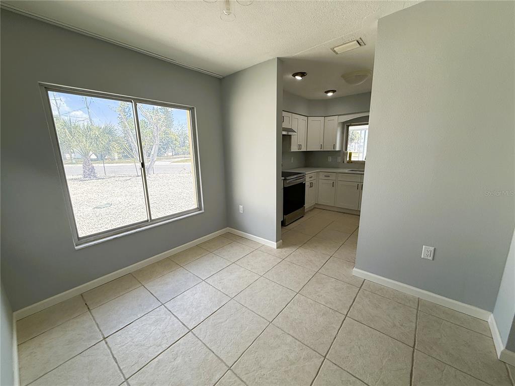 500 140th Avenue East Madeira Beach, FL 33708 - Photo 7 of 30 a view of a kitchen with a sink and a window