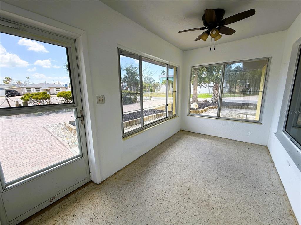500 140th Avenue East Madeira Beach, FL 33708 - Photo 10 of 30 a view of room with window and a ceiling fan