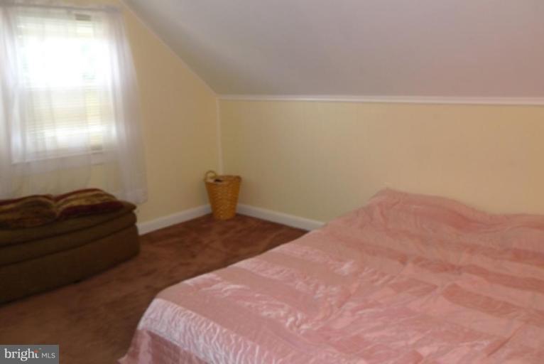 1822 Forrest Road Parkville, MD 21234 - Photo 13 of 21 a bedroom with a bed and a window