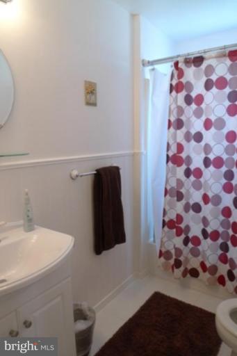 1822 Forrest Road Parkville, MD 21234 - Photo 18 of 21 a bathroom with a sink and a mirror
