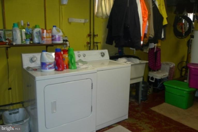 1822 Forrest Road Parkville, MD 21234 - Photo 21 of 21 a utility room with dryer and washer