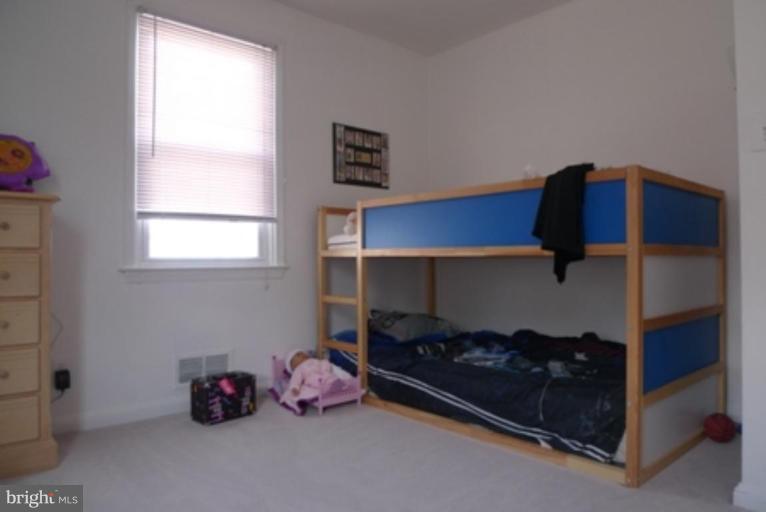 1822 Forrest Road Parkville, MD 21234 - Photo 6 of 21 a bedroom with a bed and a window